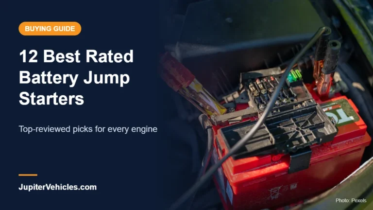 Car battery with jumper cables in an engine bay