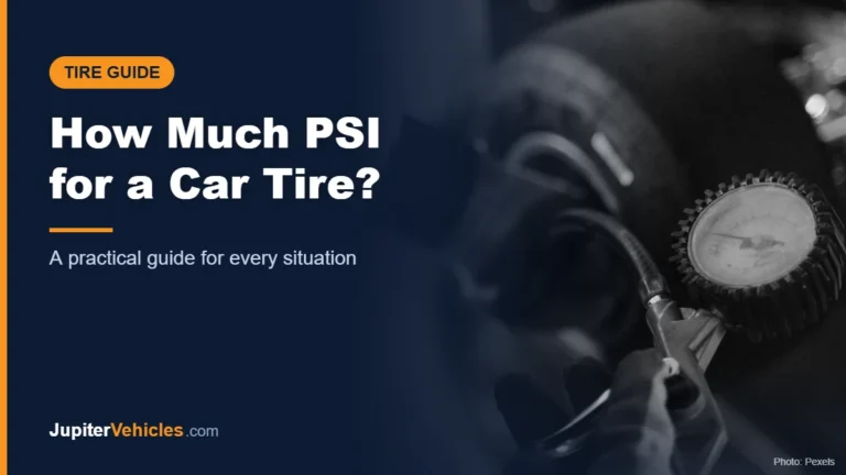 Mechanic using a gauge to check tire pressure