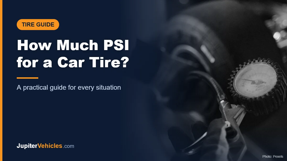 Mechanic using a gauge to check tire pressure