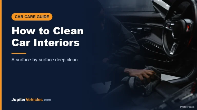 Man wiping down a car interior with a cloth during a deep clean