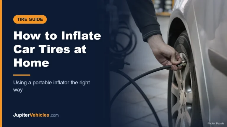 Mechanic inflating a car tire