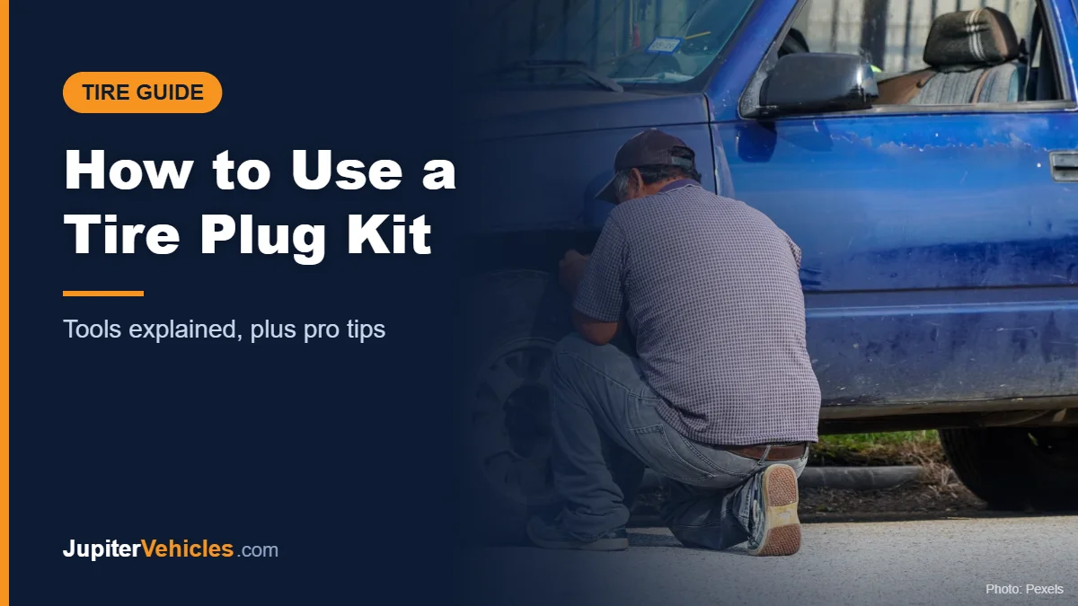 Man repairing a flat tire on a truck