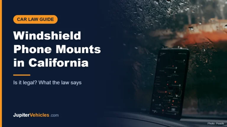Smartphone showing a GPS map on a car dashboard in the rain