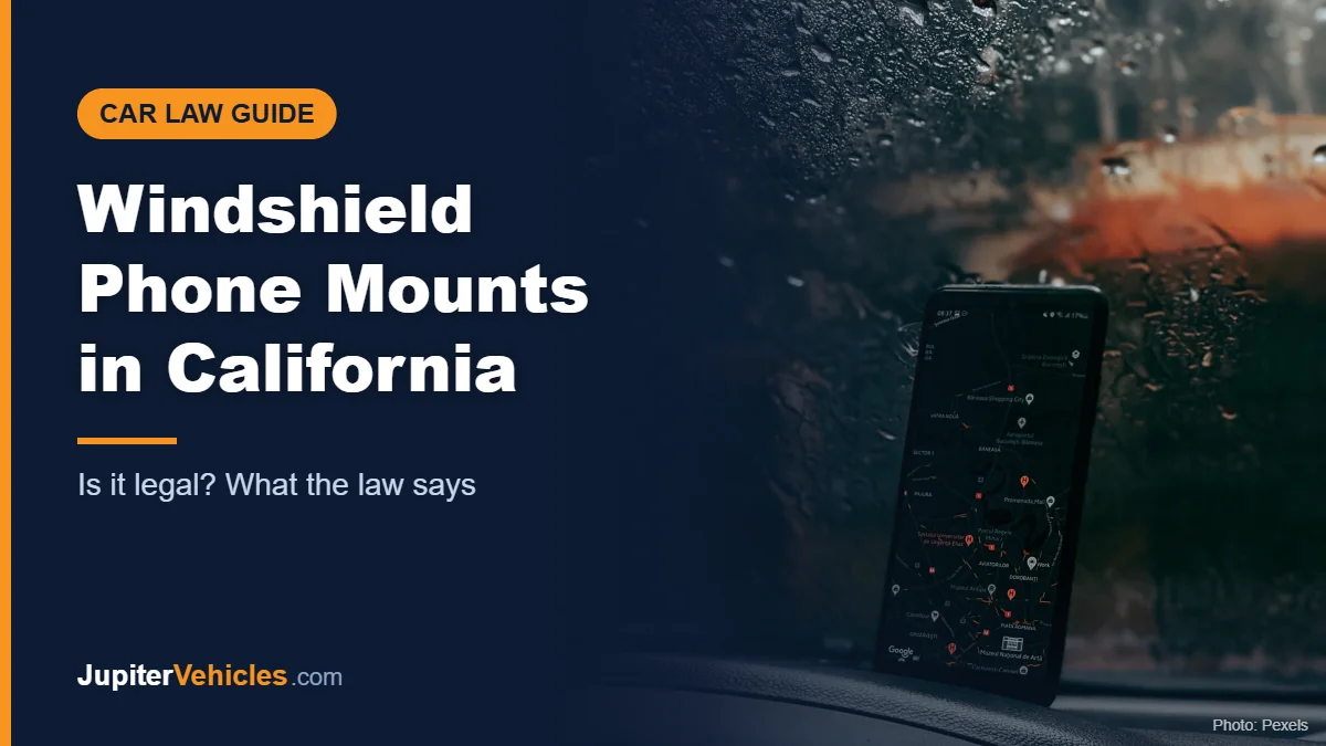 Smartphone showing a GPS map on a car dashboard in the rain