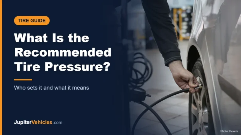 Mechanic adjusting the tire pressure of a car