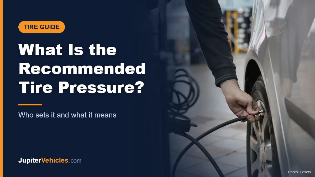 Mechanic adjusting the tire pressure of a car